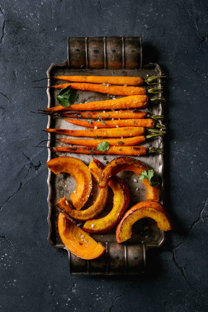 istock Roasted young carrot and pumpkin 847280240