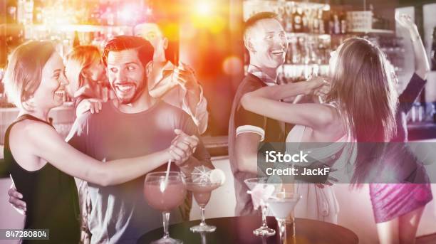Female With Man Are Dancing In Bar Stock Photo - Download Image Now - Night, Adult, Adults Only