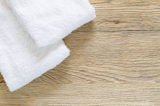 istock White towels on vintage wooden background 847287020