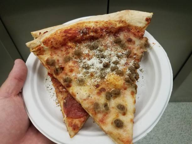 istock two slices of pizza on a plate 847291680