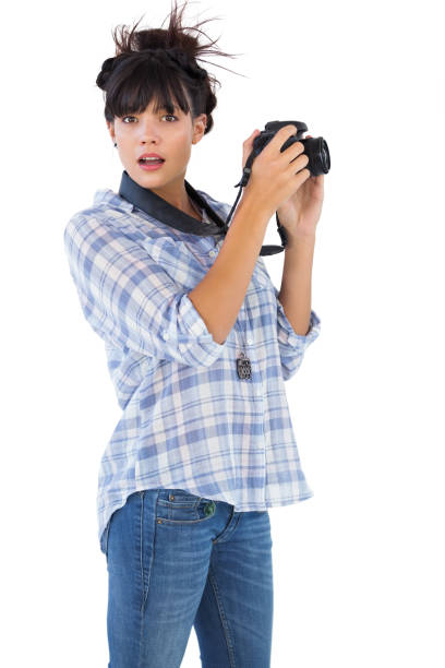 istock Astonished young woman taking picture with her camera 847291988
