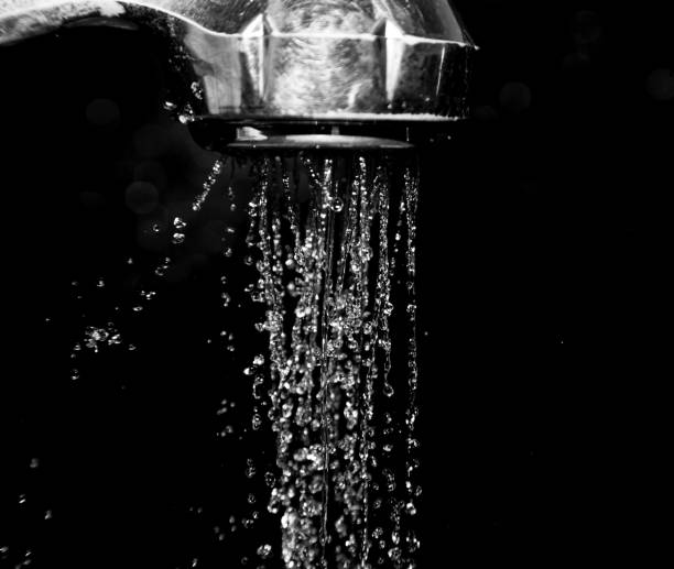 istock Shower with water isolated on a black background 847294978
