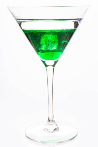 istock Cocktail glass with green alcohol close up 847297266