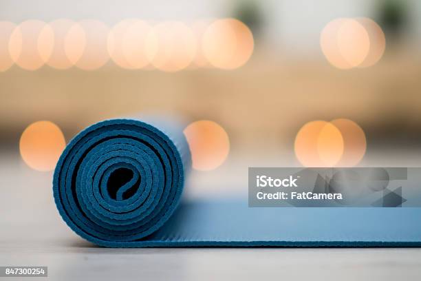 Calming Yoga Stock Photo - Download Image Now - Yoga, Exercise Mat, Backgrounds