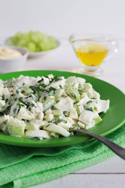 istock Plate of celery salad with dressing and olive oil 847300574