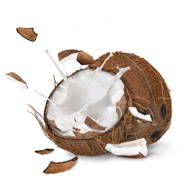 istock close-up of a coconuts with milk splash on white background 847300938
