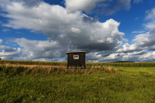 hunting lodge in the middle of fields and meadows in the highlands