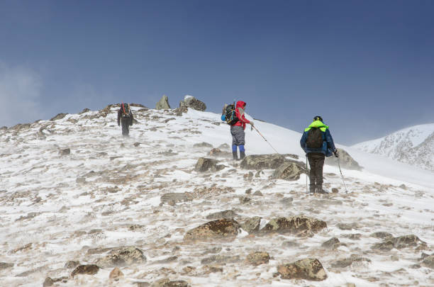 istock hiking in winter mountains. People traveling 847307930