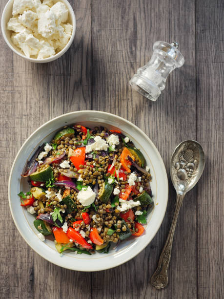 lentil and roasted vegetable salad with feta cheese - cooked vertical high angle view lentil imagens e fotografias de stock