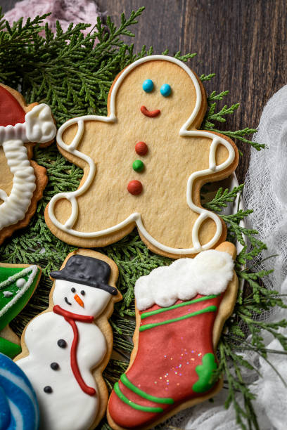 istock Christmas cookies on wooden table 847310794