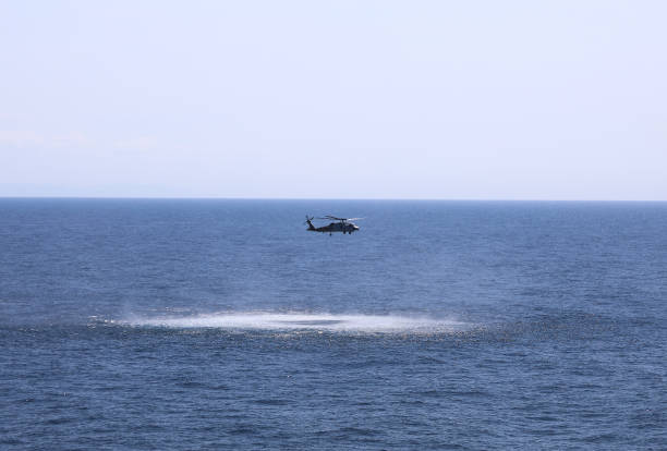 istock Helicopter hovers over gorgeous sea horizon 847315230
