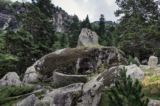 Man practicing boulder climbing