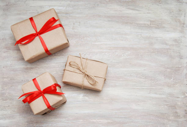 istock Gift boxes on the white wooden background 847321220