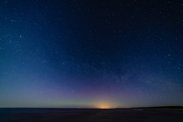 istock intense northern lights aurora borealis over beach 847322454
