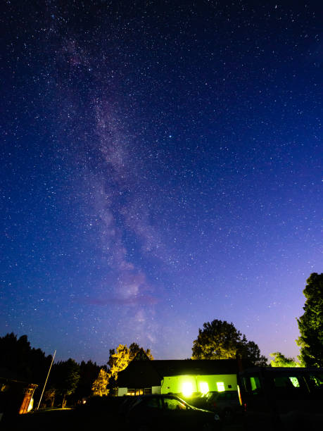 istock colorful milky way galaxy seen in night sky over trees 847322492