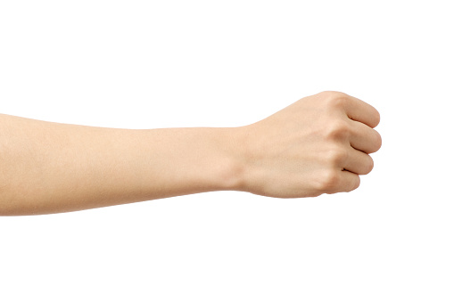 Woman's hand with fist gesture isolated on white