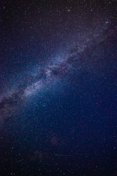 istock colorful milky way galaxy seen in night sky over trees 847322656