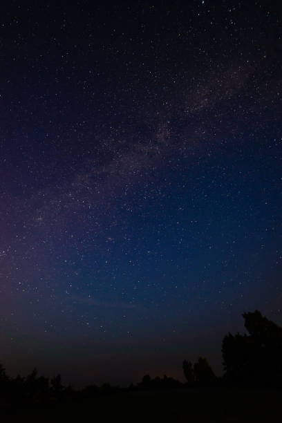 istock colorful milky way galaxy seen in night sky over trees 847323170