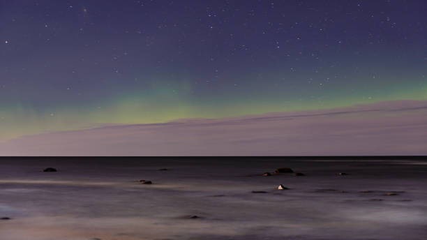 istock intense northern lights aurora borealis over beach 847325412