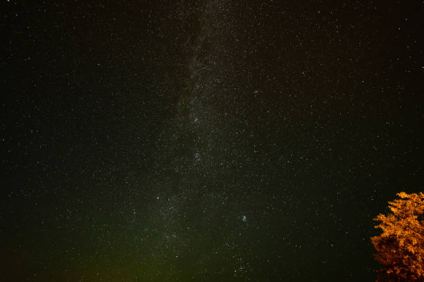 istock colorful milky way galaxy seen in night sky over trees 847325540