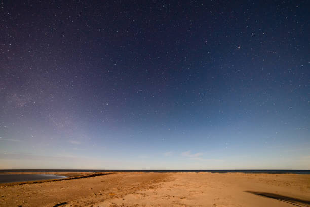 istock intense northern lights aurora borealis over beach 847325578