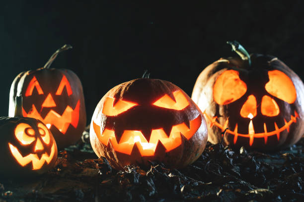 istock Halloween pumpkins at wood background 847327010