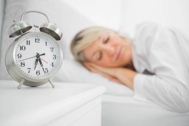 istock Blonde woman sleeping in bed 847330842