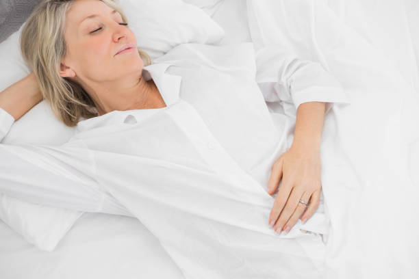 istock Woman asleep in bed 847331108