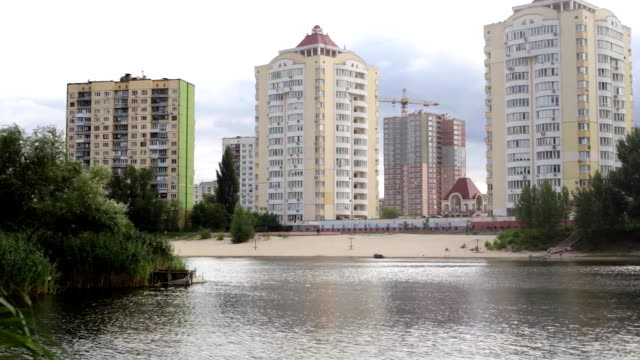 park with a lake in a residential area
