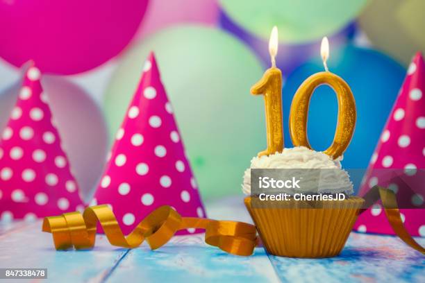 Birthday Celebration With Cupcake And Candle Stock Photo - Download Image Now - 10-11 Years, Anniversary, Birthday