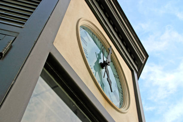 istock Interesting view of street clock blue sky clouds 847339144