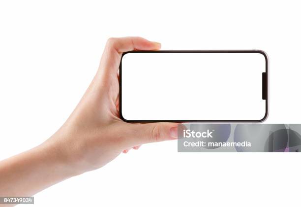 Manos De Niña Con Negro Elegante Teléfono Aislado En Blanco Foto de stock y más banco de imágenes de Horizontal