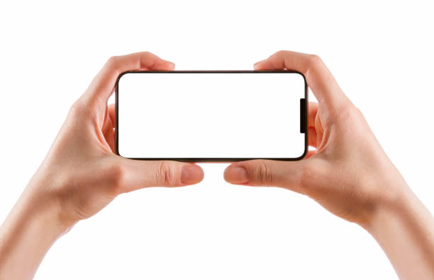 istock Young girl hands holding black smart phone isolated on white 847349050
