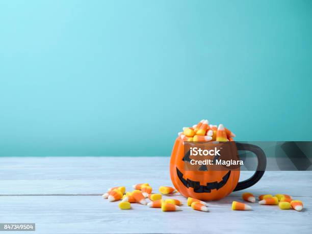 Halloween Celebration Concept With Candy Corn Stock Photo - Download Image Now - Candy Corn, Halloween, Cup