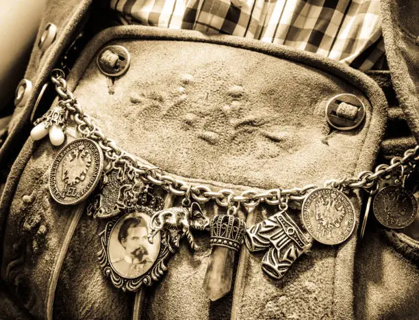 close-up of a typical bavarian "krachlederne" - traditional clothing with antique coins