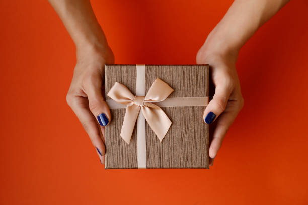 istock Woman hand holding gift box 847354050