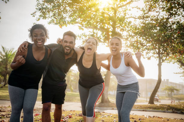 istock four brazilian friends cheering at beach at sunset hour 847357804
