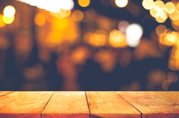 istock Wood table with blur light in night cafe,restaurant background 847367776