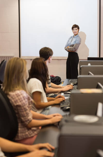 istock Teacher standing in front of projection screen 847379834