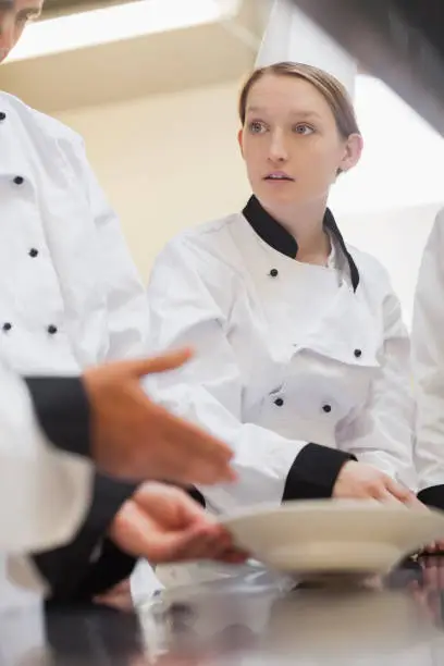 Photo of Trainee chef listening to teacher