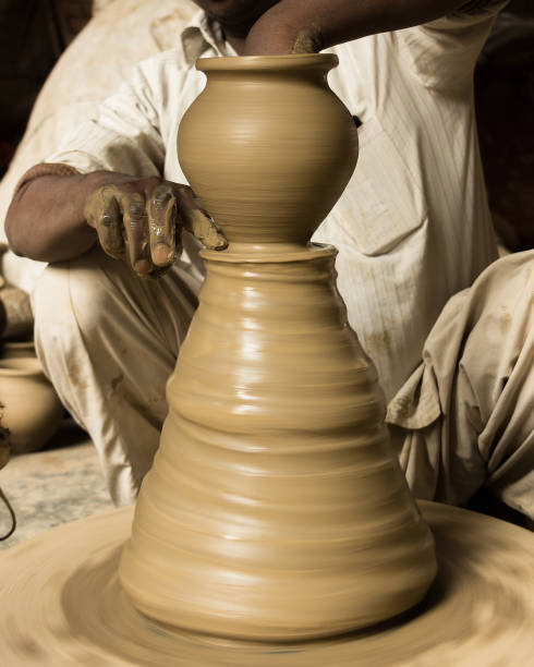 istock potter making clay pot on manual pottery wheel 847386808