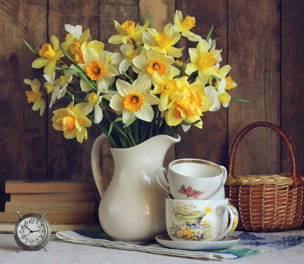 istock Bouquet of yellow daffodils in a white jug. 847390362