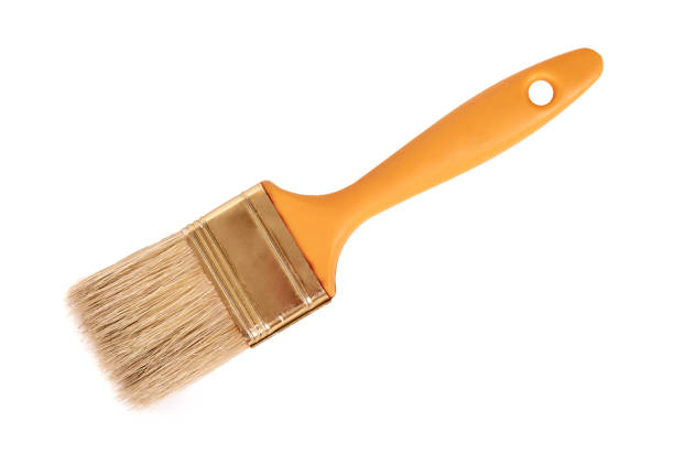 New paintbrush for oil paints close up. Isolated on white background. Painting equipment.