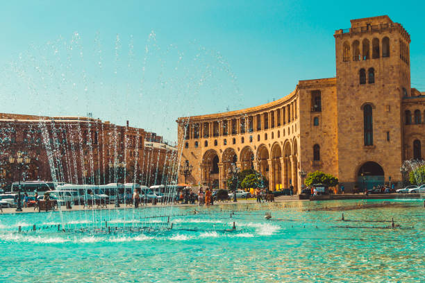 Dancing Fountains and architectural complex on Republic Square. Touristic architecture landmark. Sightseeing in Yerevan. City tour. Government House. Travel and tourism concept. Sunny autumn day.