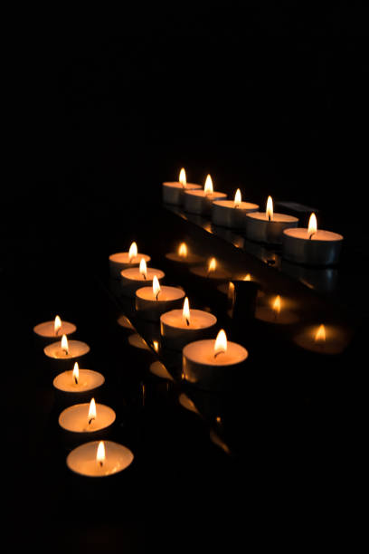 istock Candles at the alter lighting up the darkness 847396986