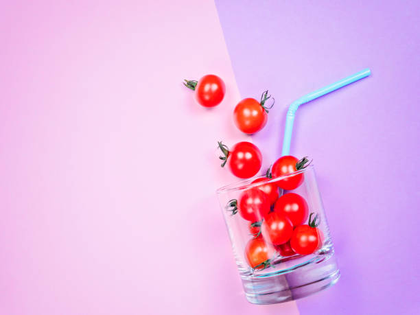 istock Tomato juice or smoothie, cherry tomato in drink glass with straw 847400470