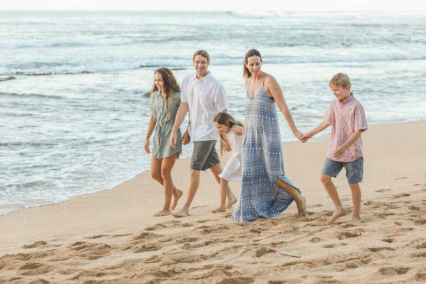istock Family walk on the beach 847400880