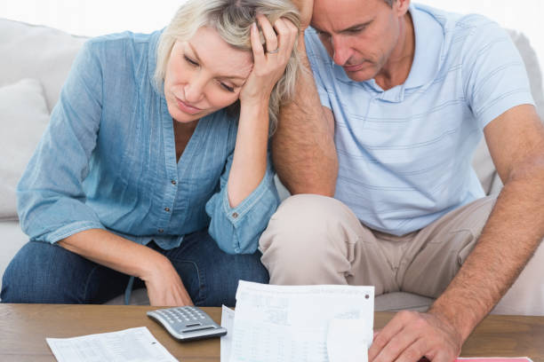 istock Worried couple going over bills 847404078