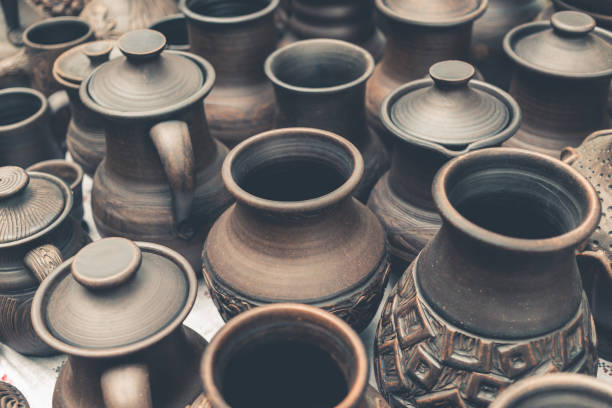istock Many handmade brown clay pots, bowls, mugs 847407200