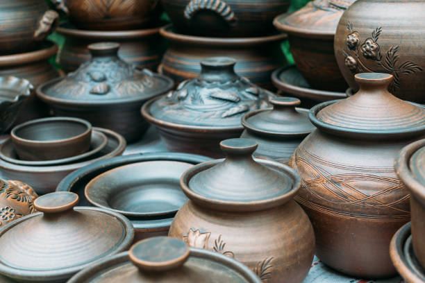 istock Many handmade brown clay pots, bowls, mugs 847408118